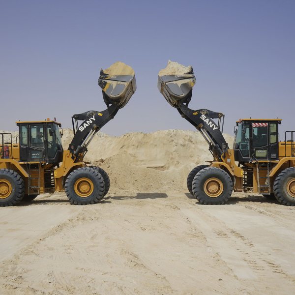 Image of Two 5 Tonne Wheeled SANYs In Action Handling San