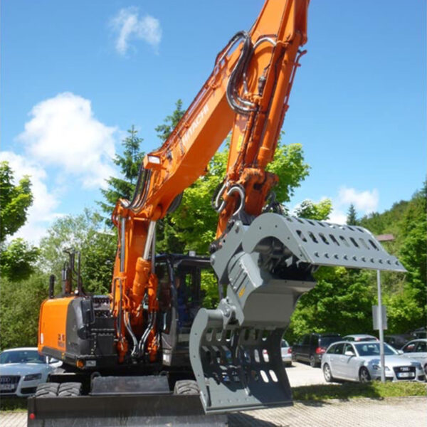 Digger with a selector grapple on the front