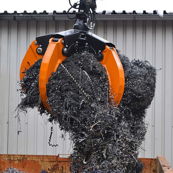 scrap metal wires being picked up by an orange peel grab