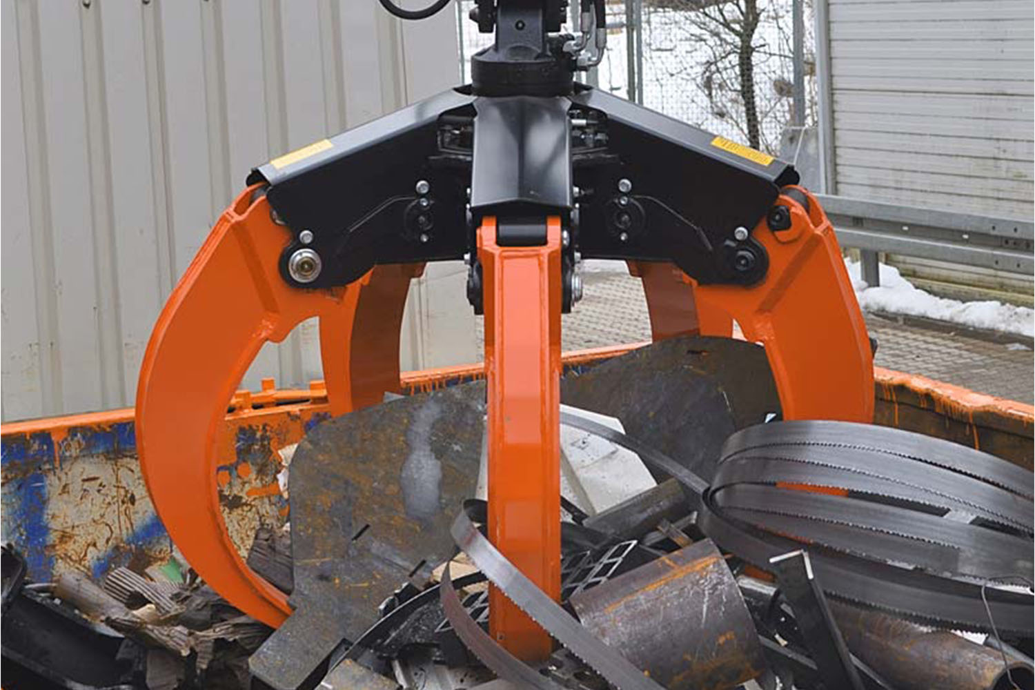 orange peel grappler grabbing scrap metal